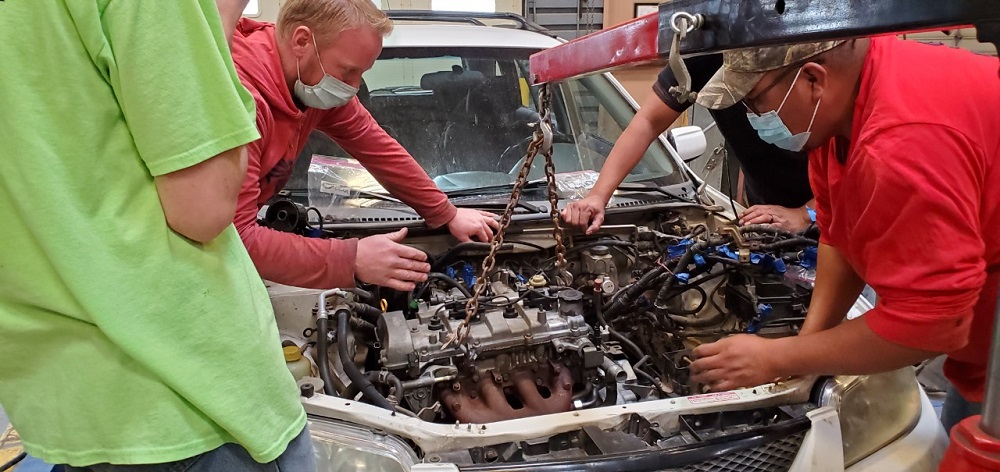 Automotive Students Install an Engine